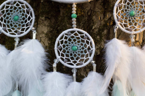 istock Handmade dream catcher with feathers threads and beads rope hanging 957532684