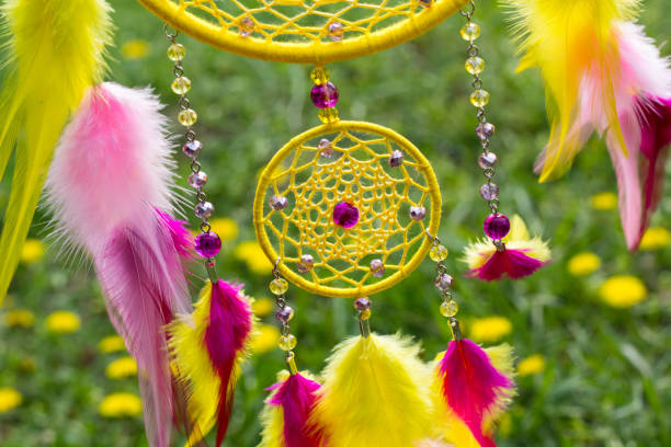 istock Handmade dream catcher with feathers threads and beads rope hanging 957535142