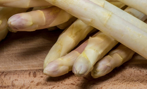 istock Asparagus on wood background 957539470