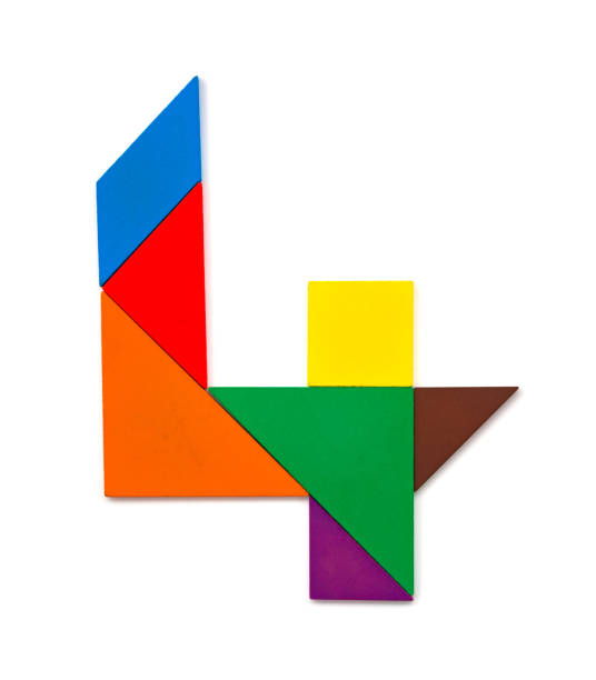 istock wooden tangram shaped like a number 4 on white 957539740