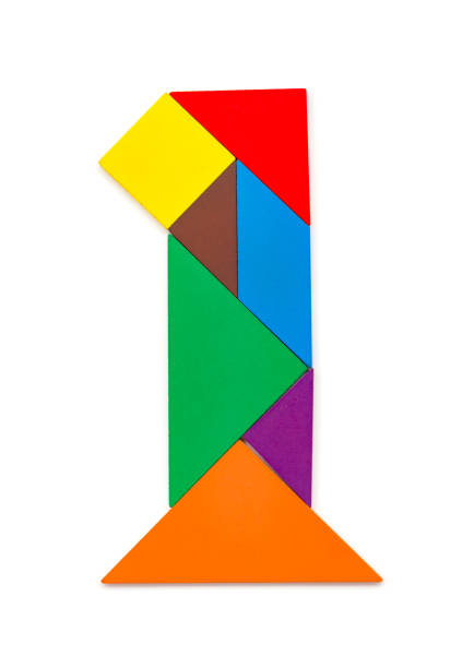 istock wooden tangram shaped like a number 1 on white 957540714