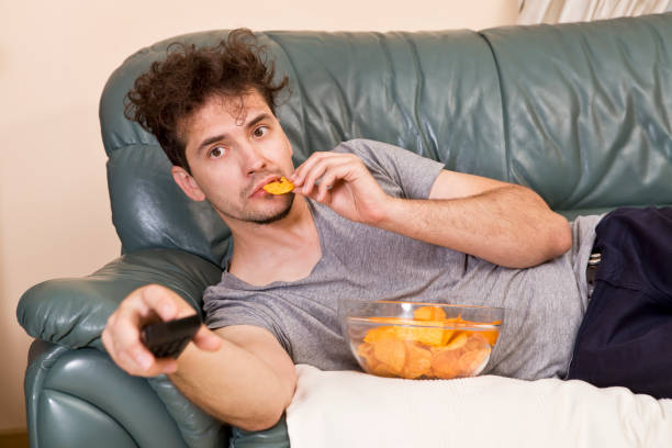 man's relax after work, beer and chips. lazy man - routine foods and drinks clothing household equipment imagens e fotografias de stock