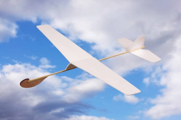 istock DIY foam board plane in front of cloudy sky 957544512