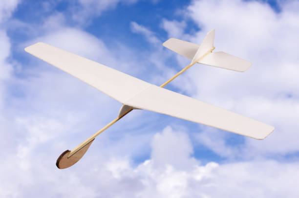 istock DIY foam board plane in front of cloudy sky 957544542