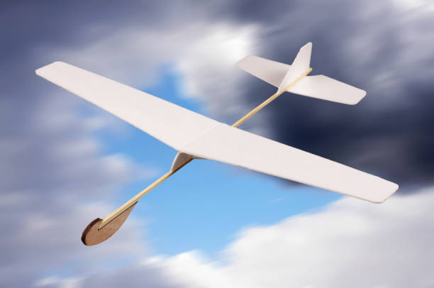 istock DIY foam board plane in front of cloudy sky 957544588
