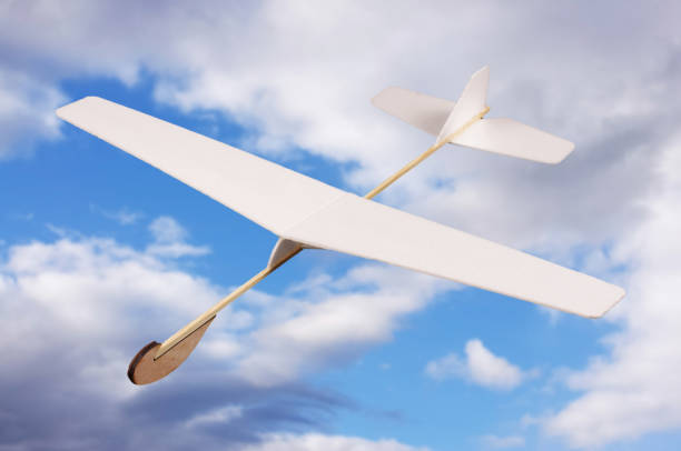 istock DIY foam board plane in front of cloudy sky 957544640