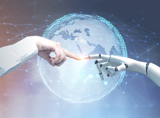 istock Human and robot hands reaching out, planet 957545028