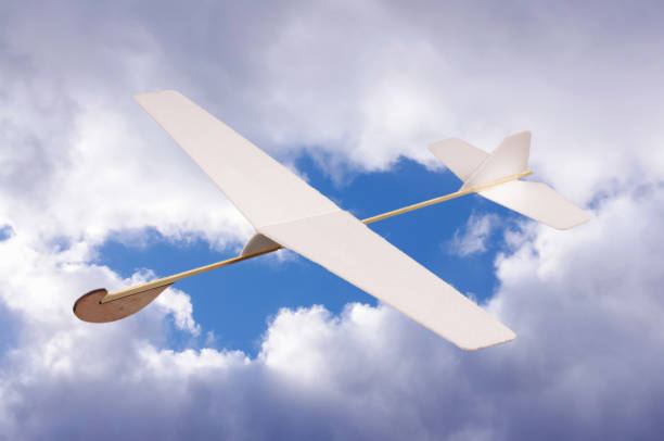 istock DIY foam board plane in front of cloudy sky 957546604