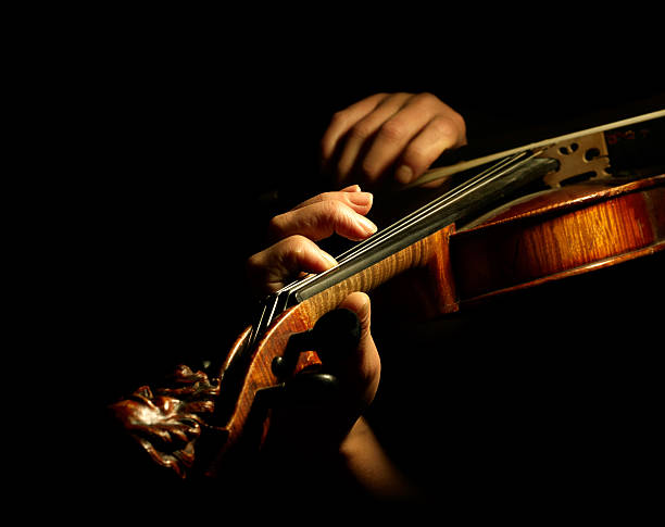 Close-up of a violin being played stock photo