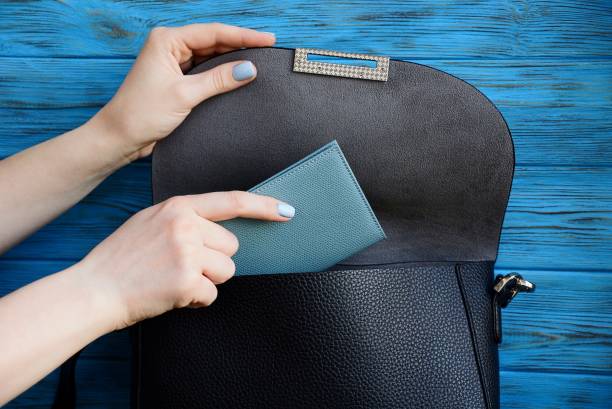 istock the girls hand grabs a notebook from a black bag 957549942