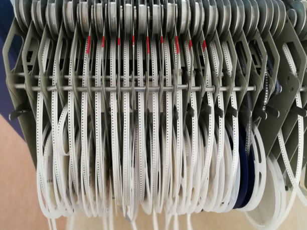 istock Various electronic component reels loaded in feeders of Pick and Place machine 957556534