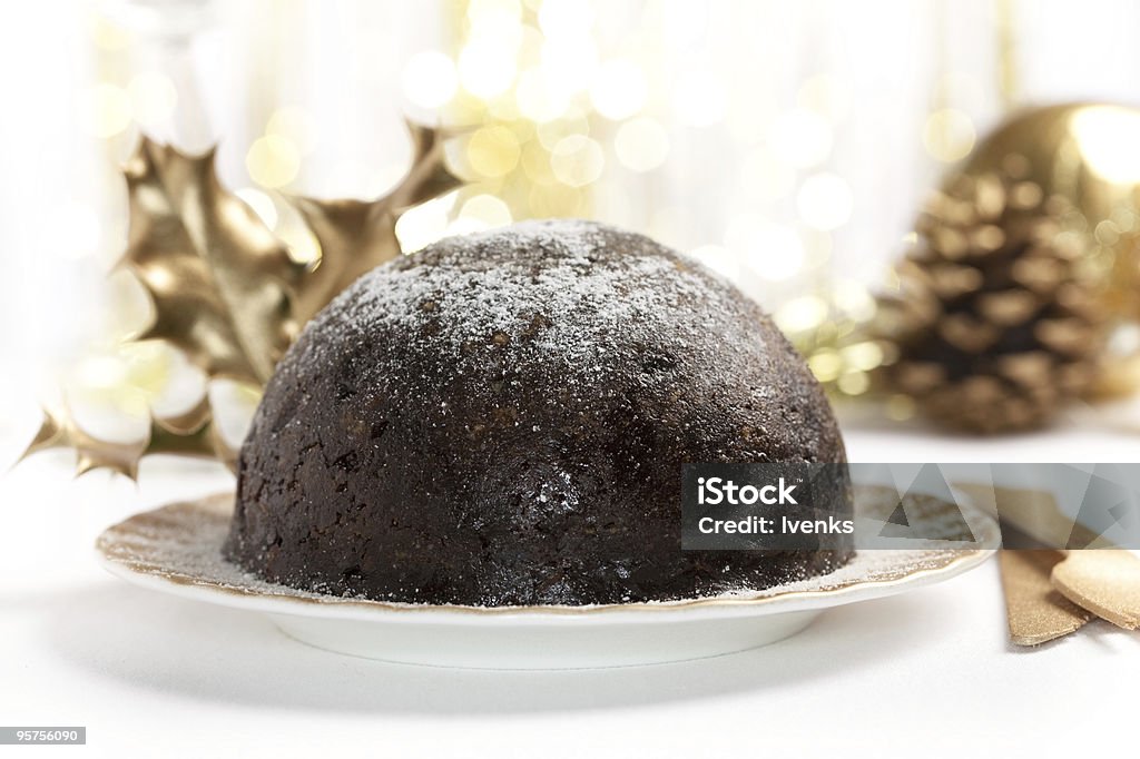 christmas pudding mit goldene Dekoration auf Tisch im Hintergrund - Lizenzfrei Beleuchtet Stock-Foto