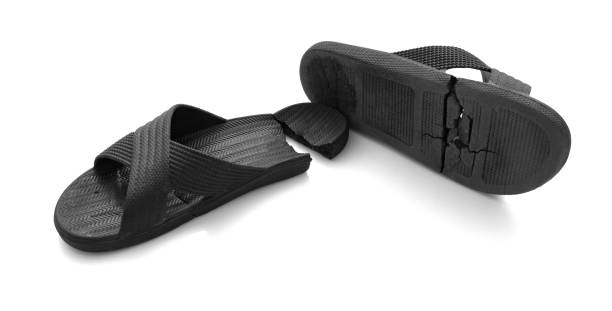 istock pair of badly worn out slippers on white 957563538