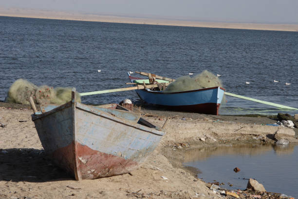 istock Fishing boats and lake 957568514
