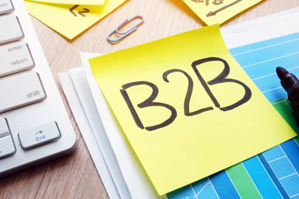 istock B2B written on a memo stick. Business to business concept. 957571004