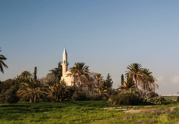 Minaret of a mosque on the sunset over blue sky