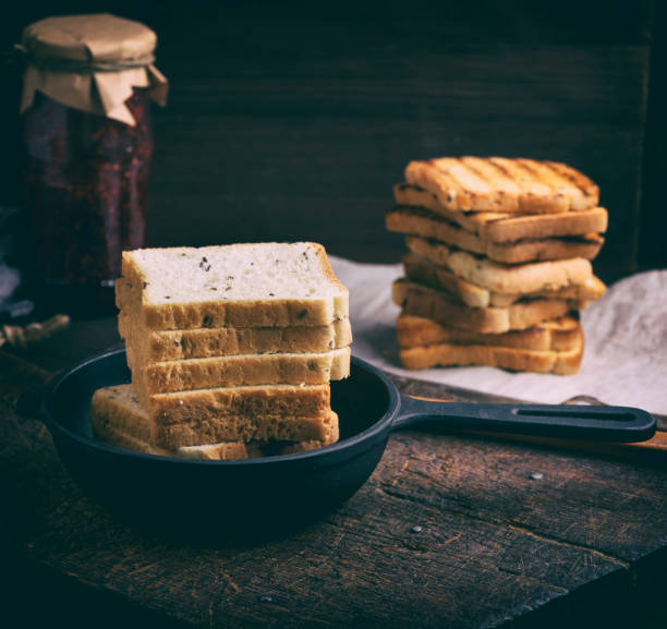 square pieces of white wheat flour in a black cast-iron frying pan