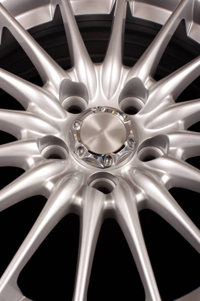 istock Shiny new alloy wheel rims for car 957579526