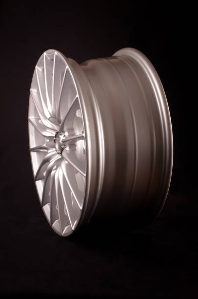 istock Shiny new alloy wheel rims for car 957579744