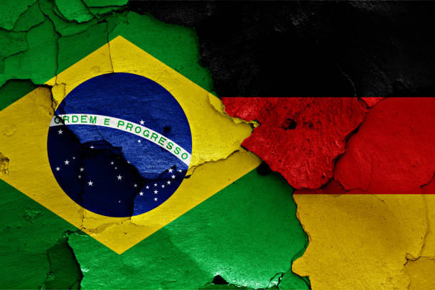 istock flags of Brazil and Germany painted on cracked wall 957579882