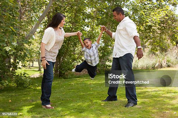 Young Hispanic Family Having Fun In The Park Stock Photo - Download Image Now - Family, Latin American and Hispanic Ethnicity, Swinging