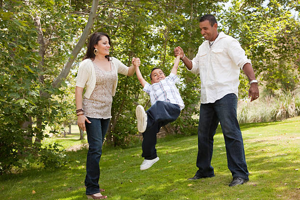istock Young Hispanic Family Having Fun in the Park 95758225