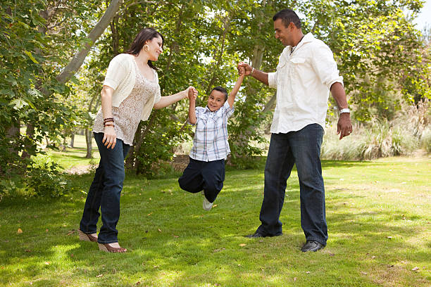 istock Young Hispanic Family Having Fun in the Park 95758226
