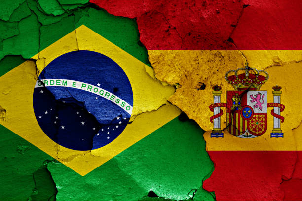 istock flags of Brazil and Spain painted on cracked wall 957582880