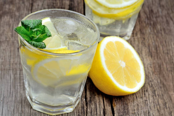 istock Detox water with fresh lemon and mint on table 957583002