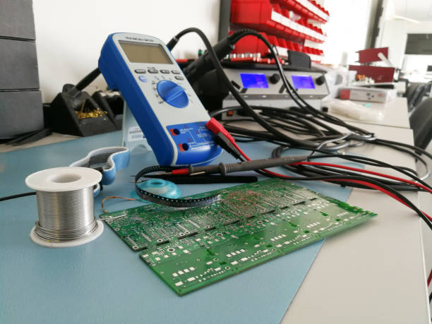 istock Close up of manual electronic tools and equipment on the electronics engineer desktop 957583134