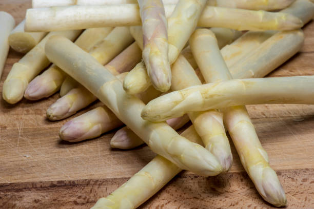 istock Asparagus on wood background 957583922