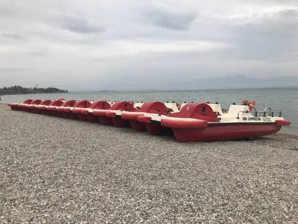 Pedals boats waiting for hire Lake Garda, Italy