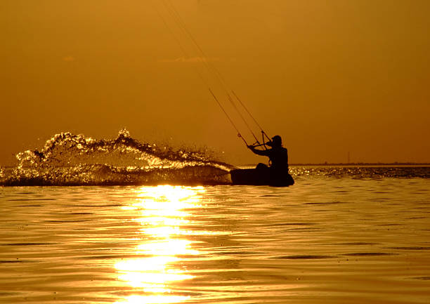 Kite Surfing on waves at sea in summer.