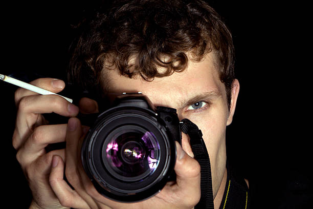 istock The young man - photographer behind work. 95759100