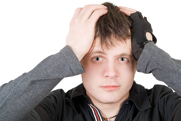 istock The young man pressure a head. Isolated 95760416