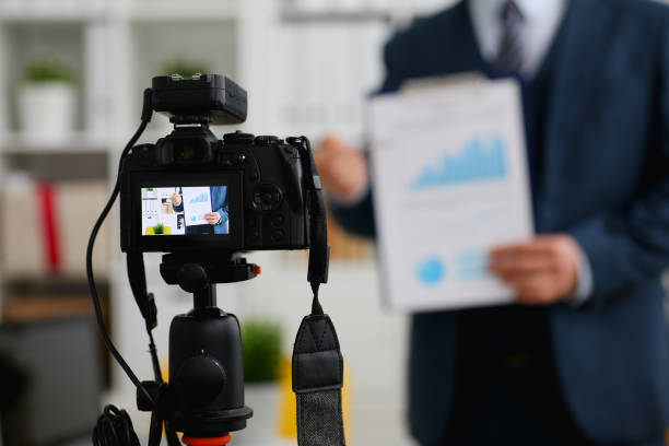 Male in suit and tie show stats graph pad