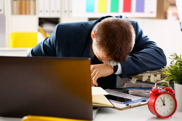 istock Red alarm clock shows late time closeup 957604998