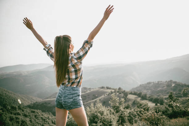 istock Sensual Female With Spread Hands Enjoying the View 957605458
