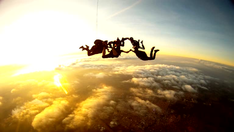 Skydiving friends at the sunset