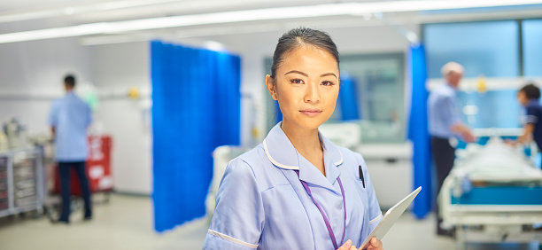 a female nurse looking  to camera