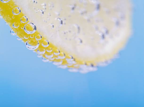lemon in a drink stock photo