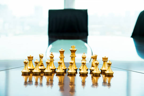 istock Golden pieces on the conference table 957612604