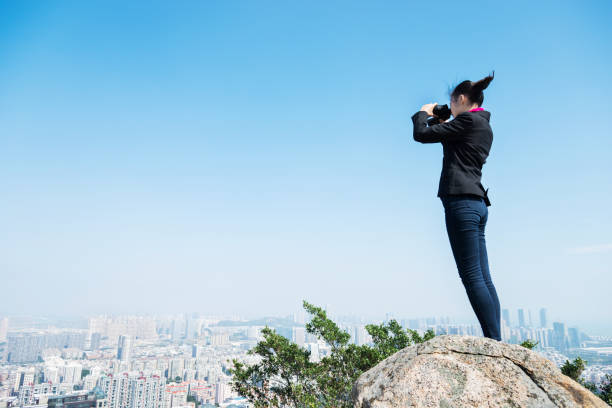 istock Businesswoman looking scenery with binocular 957617368