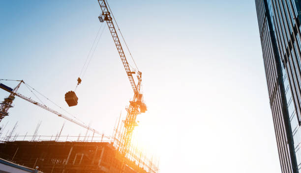 istock The crane is working at dusk 957619494