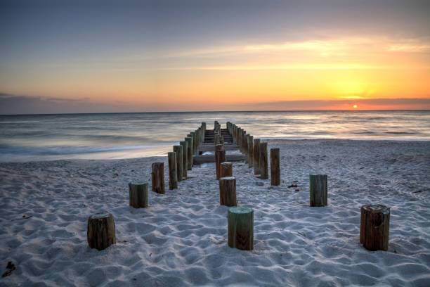 istock Ruins of the old Naples Pier at sunset 957620364