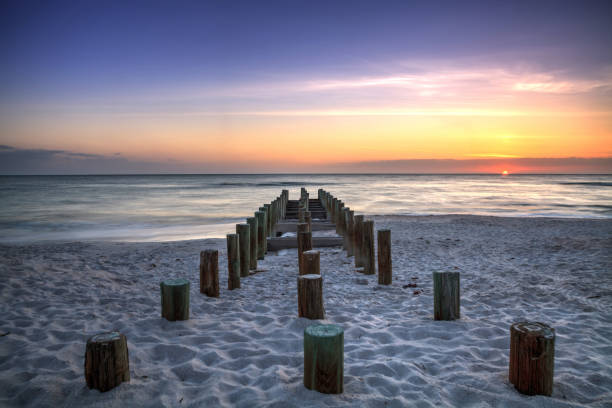 istock Ruins of the old Naples Pier at sunset 957620406