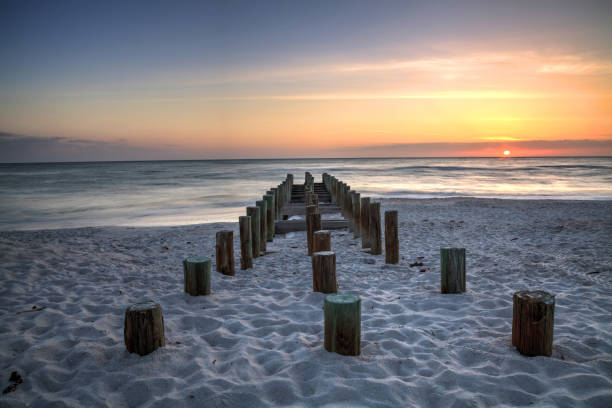 istock Ruins of the old Naples Pier at sunset 957620416