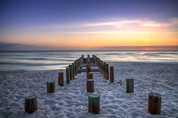 istock Ruins of the old Naples Pier at sunset 957620444