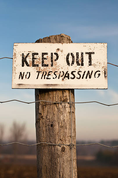 istock Keep Out No Trespassing Sign on Post with Blue Sky 95762080