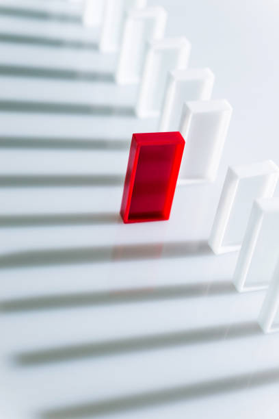 istock The red domino stands out 957623730
